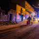 A man carries his belongings as he walks past debris of a partially collapsed house in Fleri, Sicily Italy, Wednesday, Dec. 26, 2018. A quake triggered by Italy's Mount Etna volcano has jolted eastern Sicily, slightly injuring 10 people and prompting frightened Italian villagers to flee their homes. (AP Photo/Salvatore Allegra)